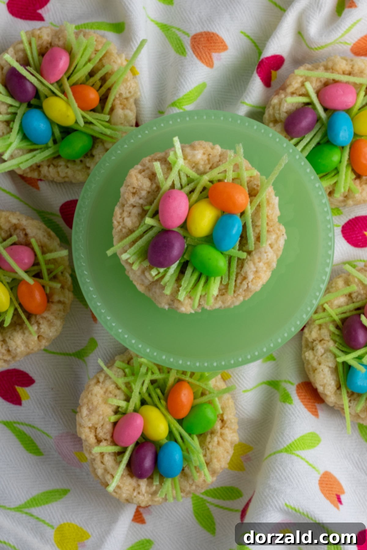 Easy Rice Krispie Easter Nests 3 Another angle of Rice Krispie Easter Nests, showing the textured cereal and colorful candy eggs ready for serving.