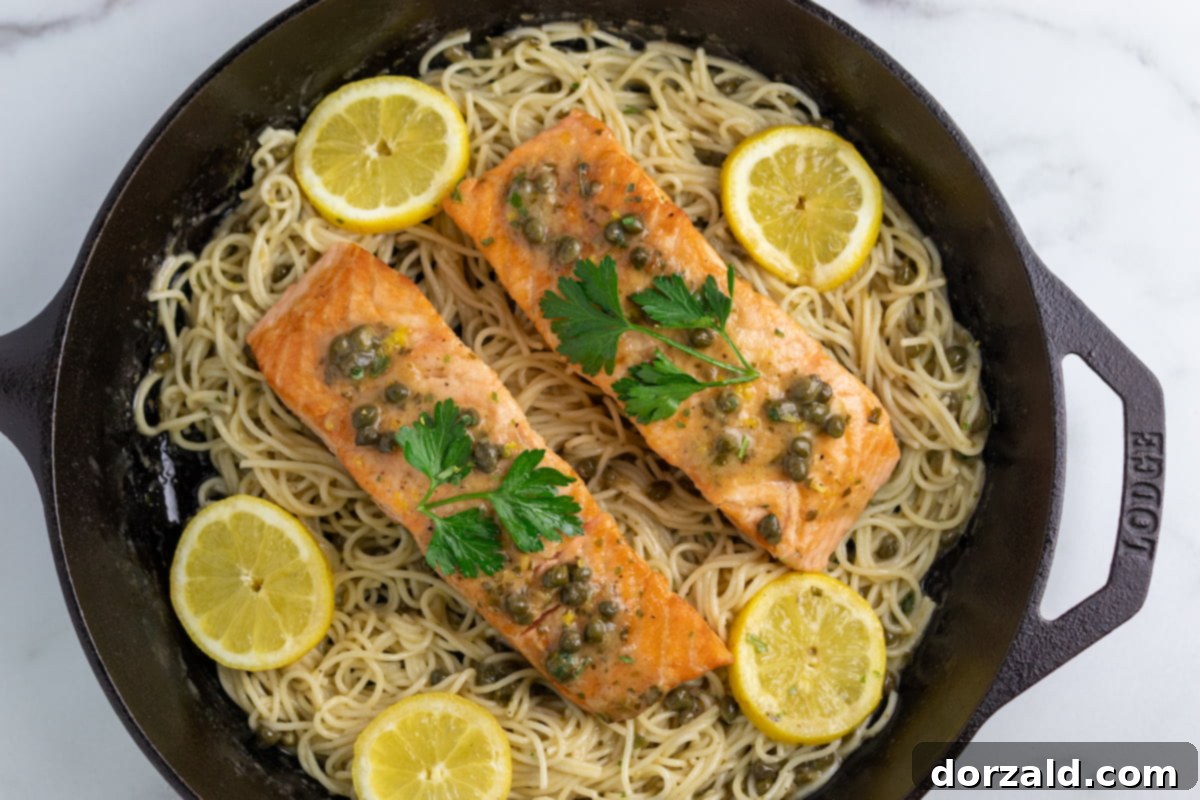 Lemon Caper Salmon Pasta Dairy Free Gluten Free 7 Salmon cooking in piccata sauce in a skillet