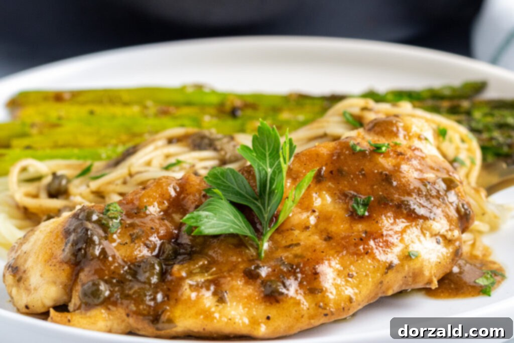 Close-up of Dairy-Free Gluten-Free Chicken Piccata with lemon slices