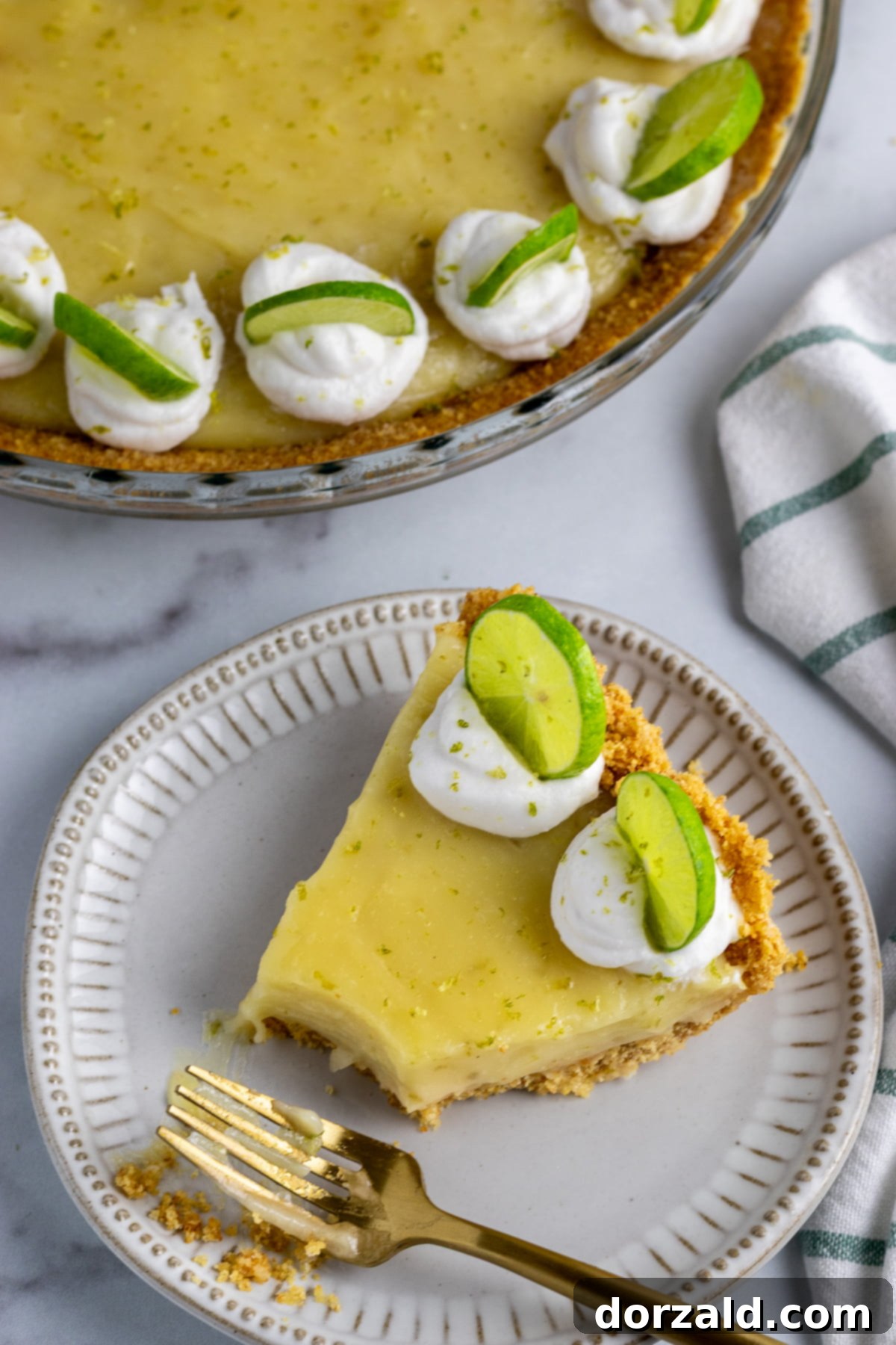 Several slices of gluten-free dairy-free key lime pie artfully arranged on a serving plate.