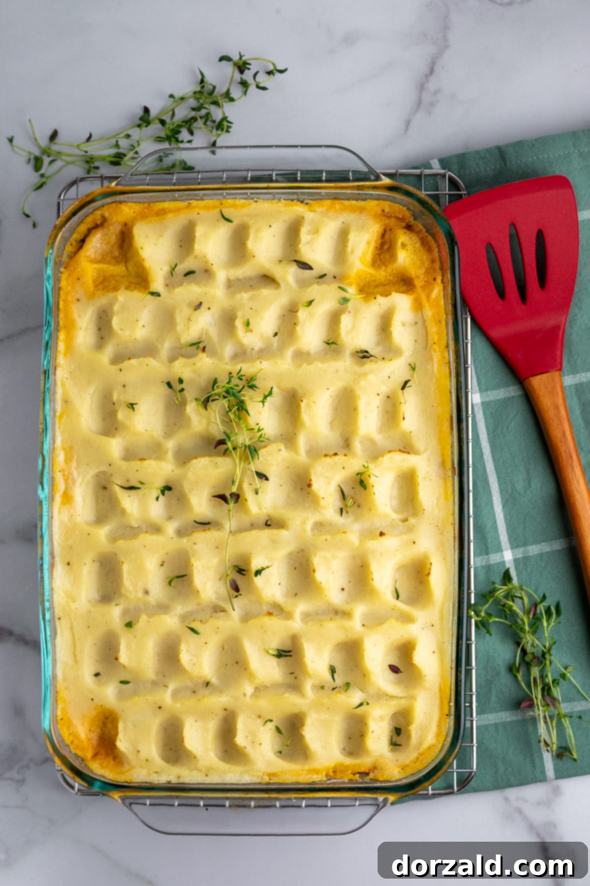 A delicious, fully baked Dairy-Free Shepherd's Pie, garnished with fresh herbs, ready to be served.