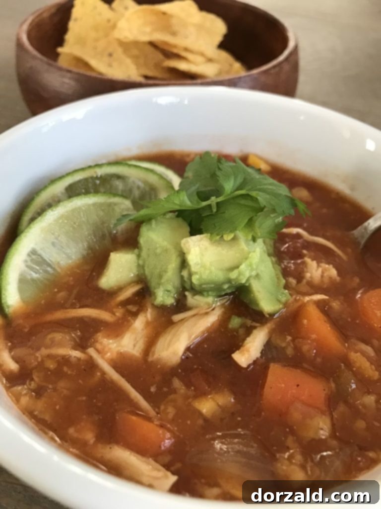 Effortless Slow Cooker Chicken Tortilla Soup 3 Hearty slow cooker chicken tortilla soup simmering in a crockpot