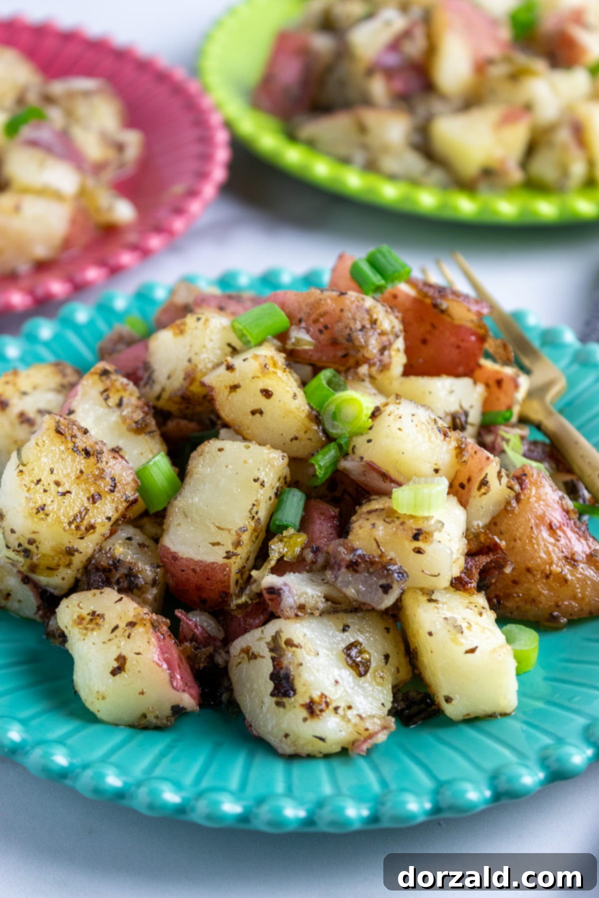 A beautifully plated serving of Zoe's Kitchen copycat grilled potato salad with a fork, ready to eat.